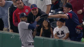 Domingo Santana Caught A Foul Ball And A Fan's Glove